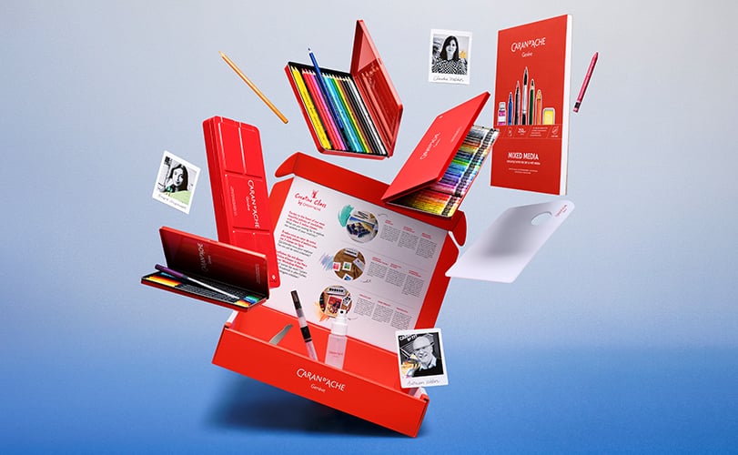 creative box opened displaying watercolor gouache wax pastels pens and colour-pencils